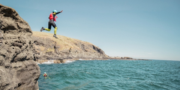 Jumping in the ocean in Edinburgh